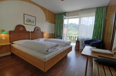 Ein Bett oder Betten in einem Zimmer der Unterkunft Landgasthof Kirchenwirt