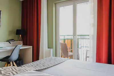 Ein Bett oder Betten in einem Zimmer der Unterkunft Hotel Alpenblick Kreischberg