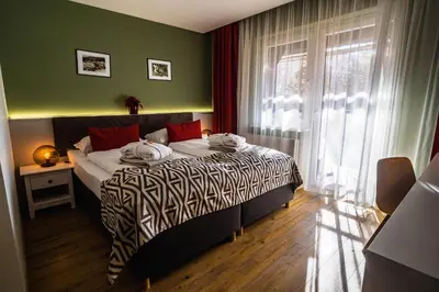 Ein Bett oder Betten in einem Zimmer der Unterkunft Hotel Alpenblick Kreischberg
