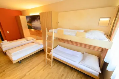 Ein Bett oder Betten in einem Zimmer der Unterkunft JUFA Hotel Grünau im Almtal
