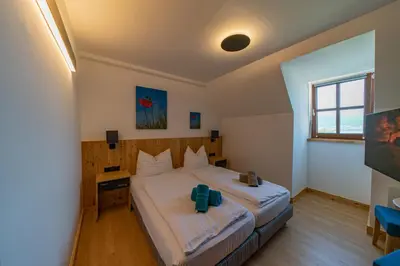 Ein Bett oder Betten in einem Zimmer der Unterkunft Haus Weyregg - Pension