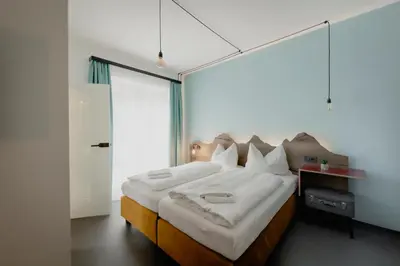 Ein Bett oder Betten in einem Zimmer der Unterkunft Bett & Berg Bad Ischl, Self Check-In