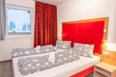 Ein Bett oder Betten in einem Zimmer der Unterkunft alpsrental Apartments Freja Obertauern