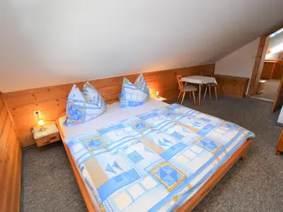 Ein Bett oder Betten in einem Zimmer der Unterkunft Illusion