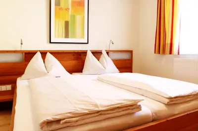 Ein Bett oder Betten in einem Zimmer der Unterkunft Hotel Binggl