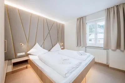 Ein Bett oder Betten in einem Zimmer der Unterkunft Crystls Aparthotel