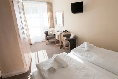 Ein Bett oder Betten in einem Zimmer der Unterkunft Crystls Aparthotel