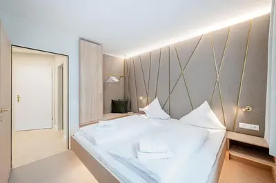 Ein Bett oder Betten in einem Zimmer der Unterkunft Crystls Aparthotel