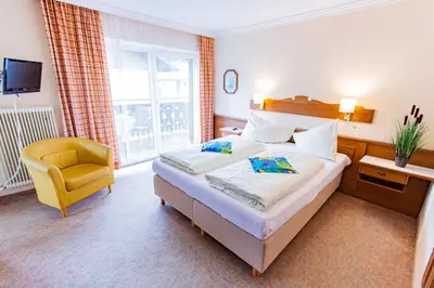 Ein Bett oder Betten in einem Zimmer der Unterkunft Soldanella 3 by Alpenidyll Apartments
