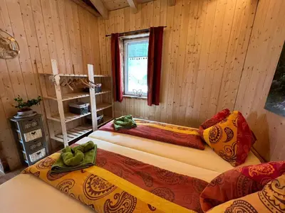 Ein Bett oder Betten in einem Zimmer der Unterkunft Gemütliches Häuschen 