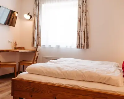 Ein Bett oder Betten in einem Zimmer der Unterkunft Ferienhof Leopold in der Grub
