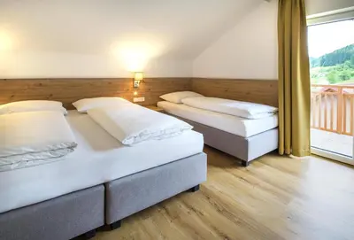 Ein Bett oder Betten in einem Zimmer der Unterkunft Appartementhaus Madlen