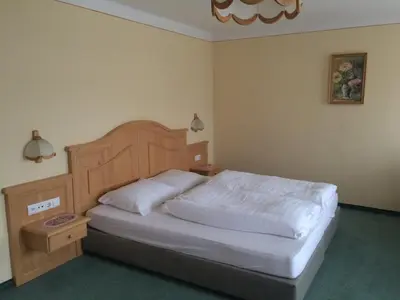 Ein Bett oder Betten in einem Zimmer der Unterkunft Gasthof Knappenwirt