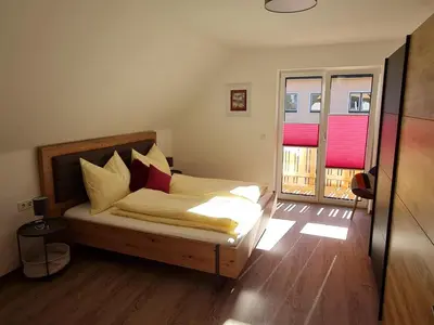 Ein Bett oder Betten in einem Zimmer der Unterkunft FrIda Appartements