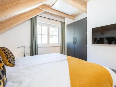 Ein Bett oder Betten in einem Zimmer der Unterkunft Chalet Hirschblick
