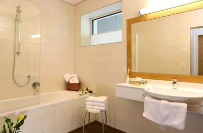 Ein Badezimmer in der Unterkunft Aparthotel Rubinius