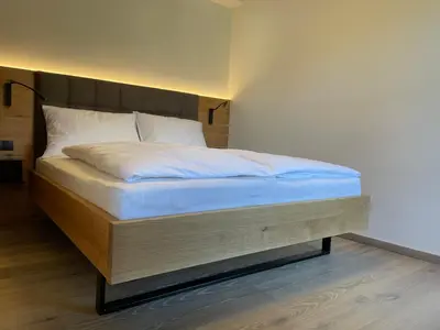 Ein Bett oder Betten in einem Zimmer der Unterkunft HAUSZEIT APPARTEMENTS
