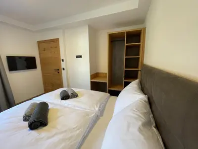 Ein Bett oder Betten in einem Zimmer der Unterkunft HAUSZEIT APPARTEMENTS