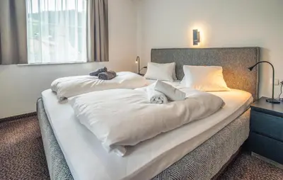 Ein Bett oder Betten in einem Zimmer der Unterkunft Schoen Eingerichtete Ferienw