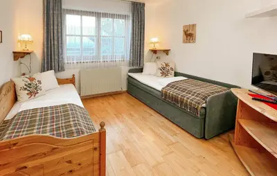 Ein Bett oder Betten in einem Zimmer der Unterkunft Ferienwohnung In Kleinarl