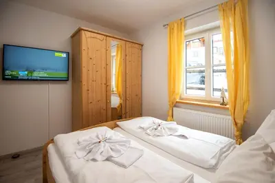 Ein Bett oder Betten in einem Zimmer der Unterkunft Apartmenthaus HAUS Gipfelglück Apartment KRUMMHOLZ