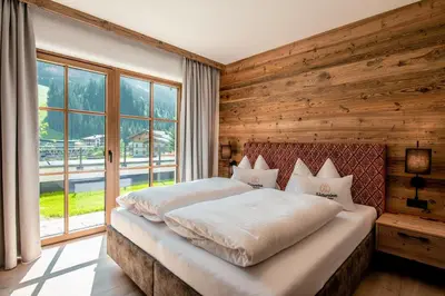 Ein Bett oder Betten in einem Zimmer der Unterkunft Natursinn Mountainchalets