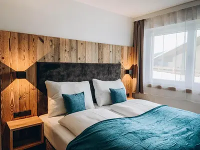 Ein Bett oder Betten in einem Zimmer der Unterkunft FOUR PEAKS Apartment