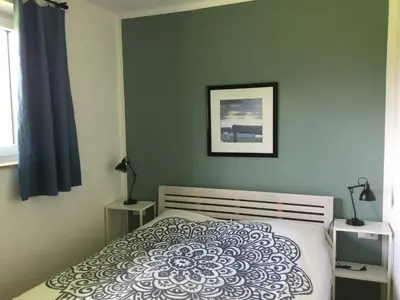 Ein Bett oder Betten in einem Zimmer der Unterkunft STEINERGUT Gartenwohnung 1