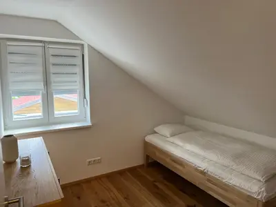 Ein Bett oder Betten in einem Zimmer der Unterkunft Ferienhaus Gmunden