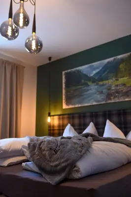 Ein Bett oder Betten in einem Zimmer der Unterkunft Lerchpeuntgut Alpenfreud Apartments