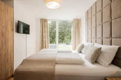 Ein Bett oder Betten in einem Zimmer der Unterkunft Granit Appartements