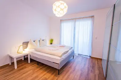 Ein Bett oder Betten in einem Zimmer der Unterkunft City Dream 1 by Alpenidyll Apartments