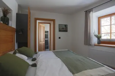Ein Bett oder Betten in einem Zimmer der Unterkunft Schneiderhaus