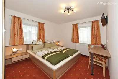 Ein Bett oder Betten in einem Zimmer der Unterkunft Appartement Haus Burgblick
