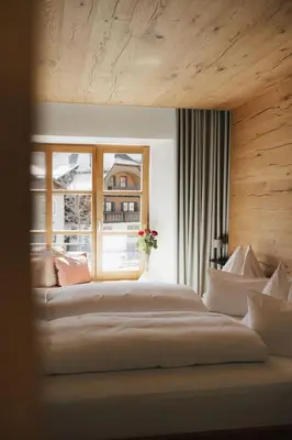 Ein Bett oder Betten in einem Zimmer der Unterkunft Mesnerhaus & Gourmetrestaurant Mesnerhaus mit 4 Hauben