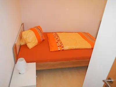 Ein Bett oder Betten in einem Zimmer der Unterkunft Ferienwohnung Schmid