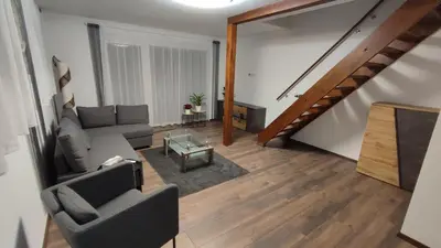 Ein Sitzbereich in der Unterkunft Panorama Apartmenthaus