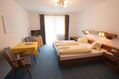Ein Bett oder Betten in einem Zimmer der Unterkunft Sporthotel Flachauwinkl