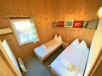 Ein Bett oder Betten in einem Zimmer der Unterkunft EXCLUSIVES Chalet an der SKIPISTE +Dampfbad +NETFLIX