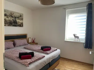 Ein Bett oder Betten in einem Zimmer der Unterkunft Albarosa Appartemant