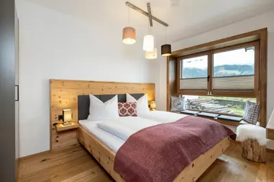 Ein Bett oder Betten in einem Zimmer der Unterkunft Holzlodge Chalets Nähe Obertauern