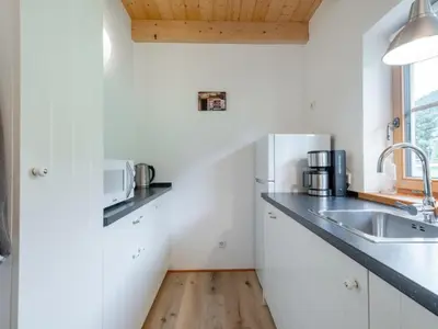 Küche/Küchenzeile in der Unterkunft Wolfgangchalet C