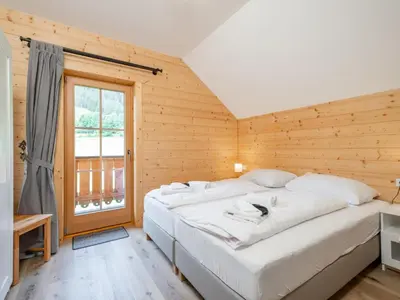 Ein Bett oder Betten in einem Zimmer der Unterkunft Wolfgangchalet A