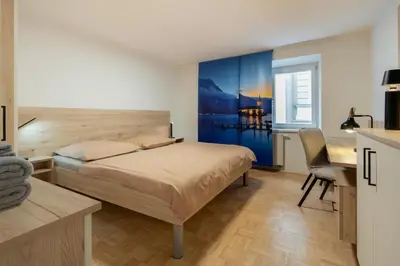 Ein Bett oder Betten in einem Zimmer der Unterkunft Modern Apartment, Full Kitchen, for 6