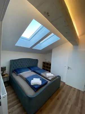 Ein Bett oder Betten in einem Zimmer der Unterkunft Living8-Appartements