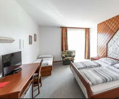Ein Bett oder Betten in einem Zimmer der Unterkunft Austria Traveller Hotel Lenzing