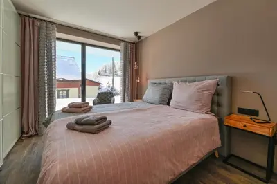 Ein Bett oder Betten in einem Zimmer der Unterkunft Dachsteinwest, Ski-in Ski-out Luxury Apartment, Free Parkplatz