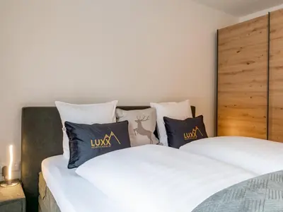 Ein Bett oder Betten in einem Zimmer der Unterkunft Mountain Chalet Luxx