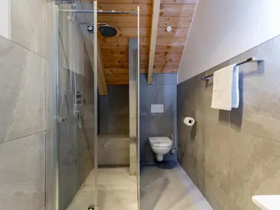 Ein Badezimmer in der Unterkunft Mountain Chalet Bergfreund