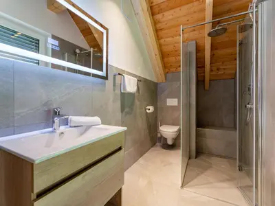 Ein Badezimmer in der Unterkunft Mountain Chalet Bergfreund